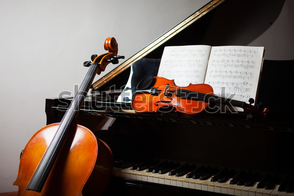 stock-photo-classical-music-concept-cello-violin-piano-and-a-score-163379336